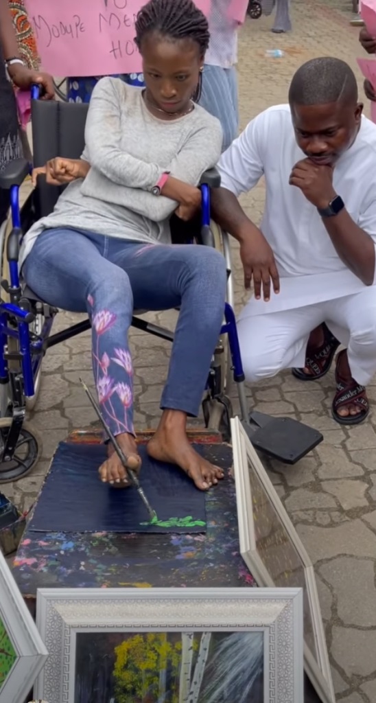 God Is Wonderful” – See Video Of A Disabled Lady Drawing With Her Legs (Watch) 3 Drawing With Her Legs